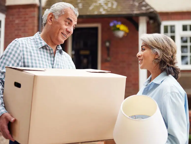 mature couple moving boxes.