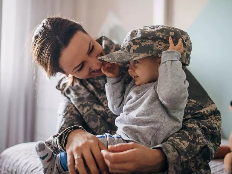 Military mother with child