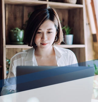 woman in dining room with laptop